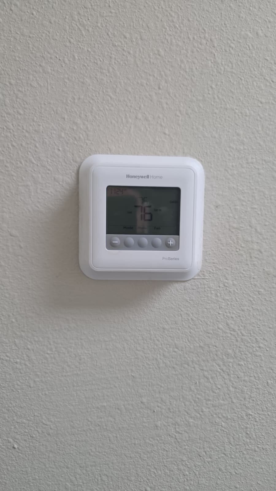 Honeywell Thermostat in New Port Richey, FL 34655 Wall-mounted Honeywell thermostat displaying temperature in New Port Richey, FL 34655.