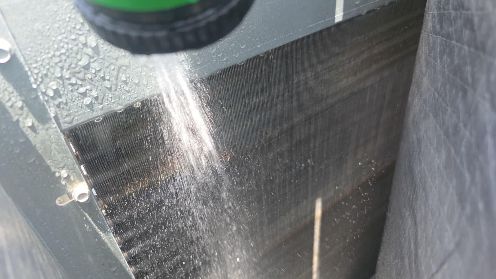 HVAC Coil Cleaning - Largo, FL 33773 Spraying water on HVAC coil for cleaning in Largo, FL 33773.