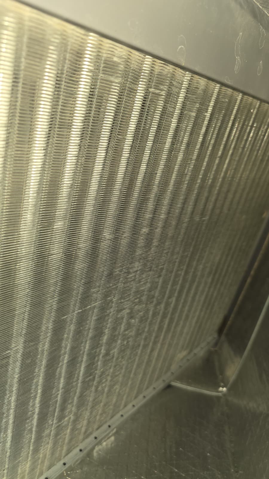 HVAC Coil Fins Close-Up - Tarpon Springs, FL 34688 Close-up of HVAC coil fins inside a unit in Tarpon Springs, FL 34688. Essential for efficient heat exchange.