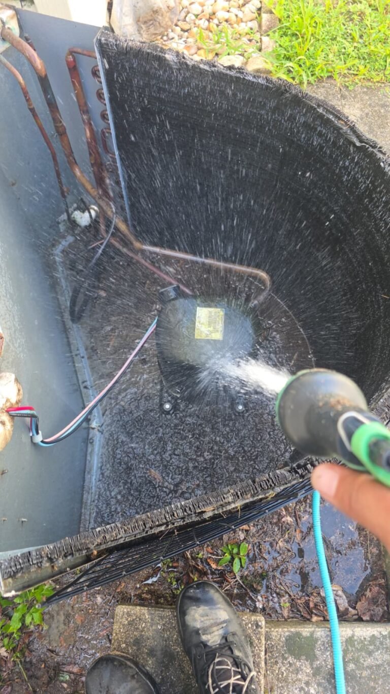 HVAC Component Cleaning in Thonotosassa, FL 33592 Spraying water on HVAC component in Thonotosassa, FL 33592