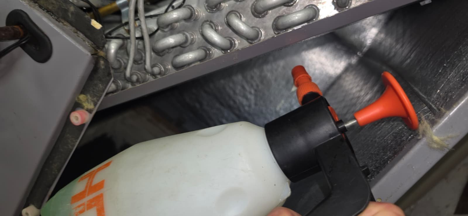 Technician working on HVAC components in Lutz, FL 33559 during Visit #4.