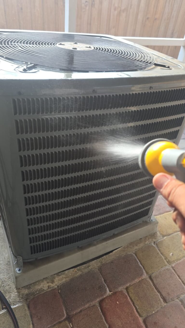 HVAC Condenser Spray Cleaning in Brandon, FL 33511 HVAC condenser unit being sprayed for cleaning in Brandon, FL 33511