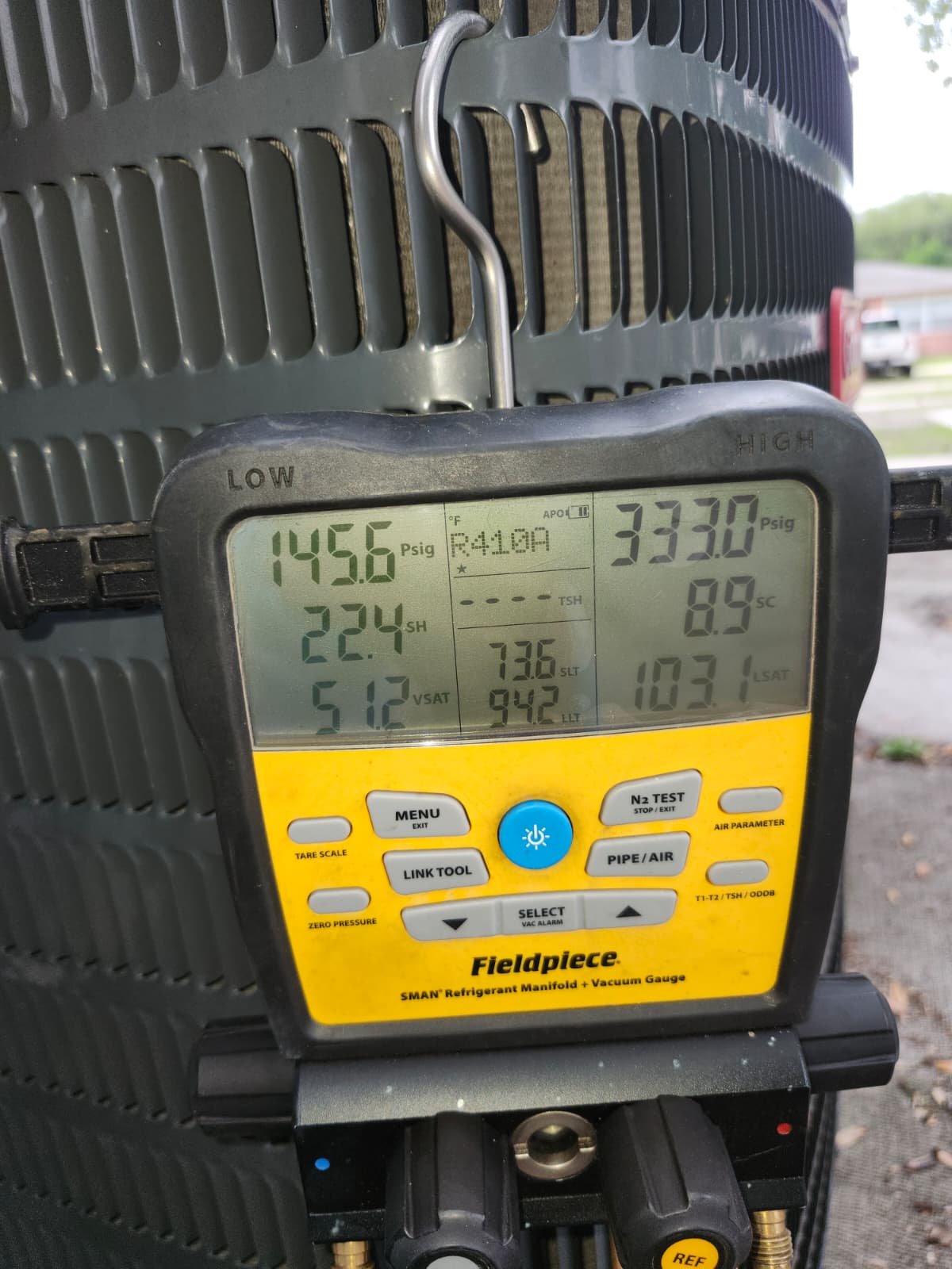 Pressure gauge readings on HVAC unit in Tampa, FL 33607.