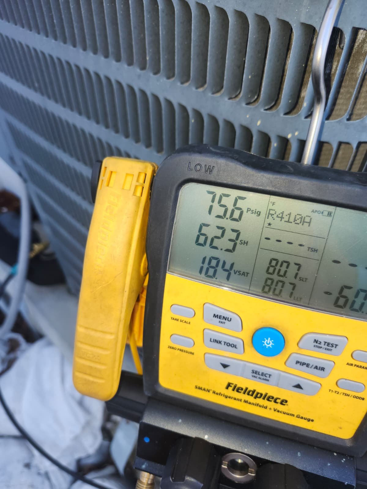 Close-up of HVAC pressure gauges in use, St. Petersburg, FL 33703.