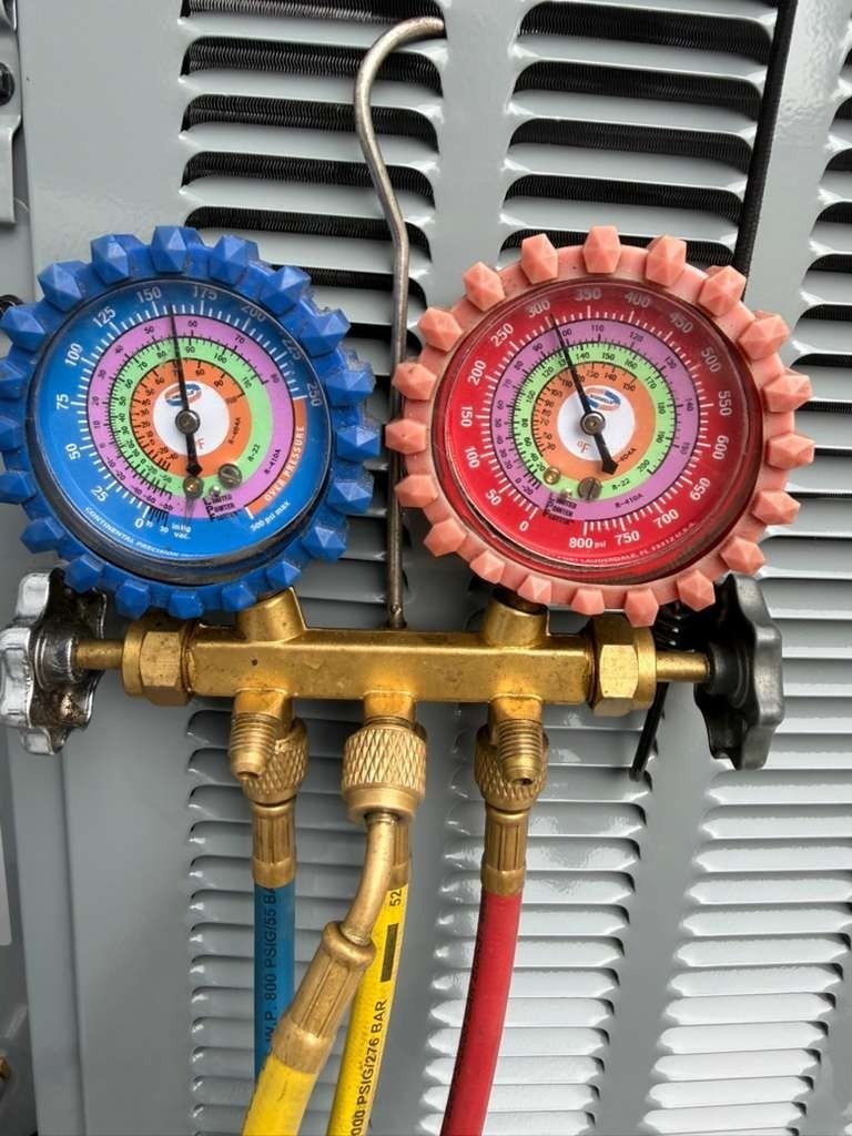 Close-up of HVAC pressure gauges in Tampa, FL 33616.
