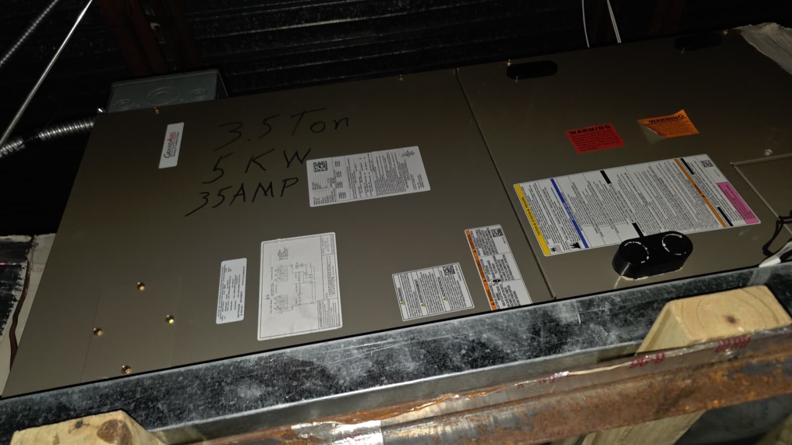 HVAC unit with specifications on casing in Tampa, FL 33634.