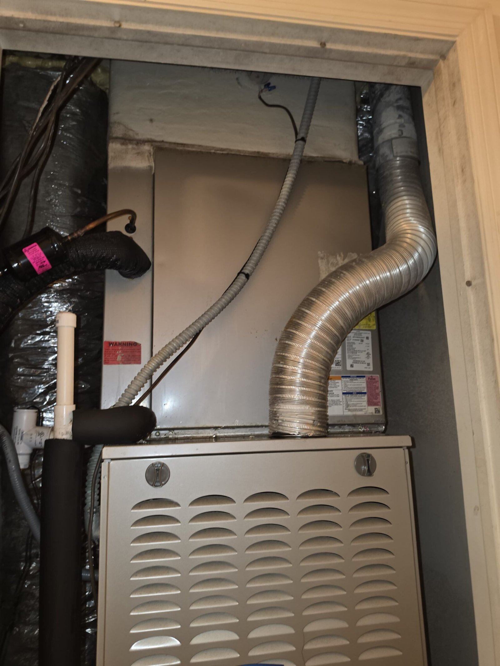 HVAC System Installation - Tampa, FL 33625 Installed HVAC system inside a utility closet in Tampa, FL 33625. Efficient heating and cooling.