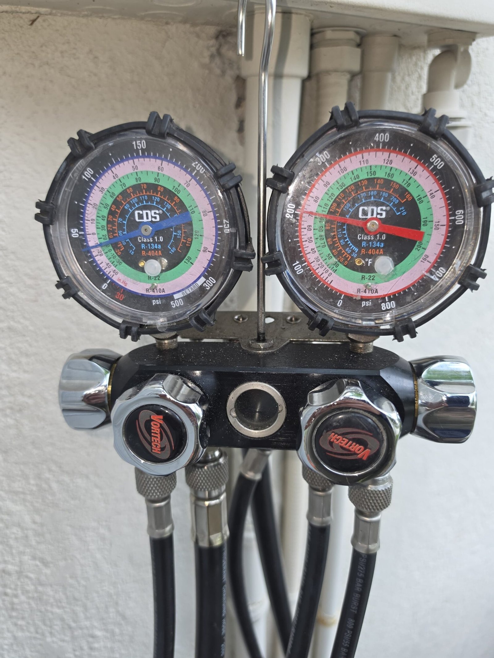 Pressure gauges connected to HVAC system in Lutz, FL 33558.
