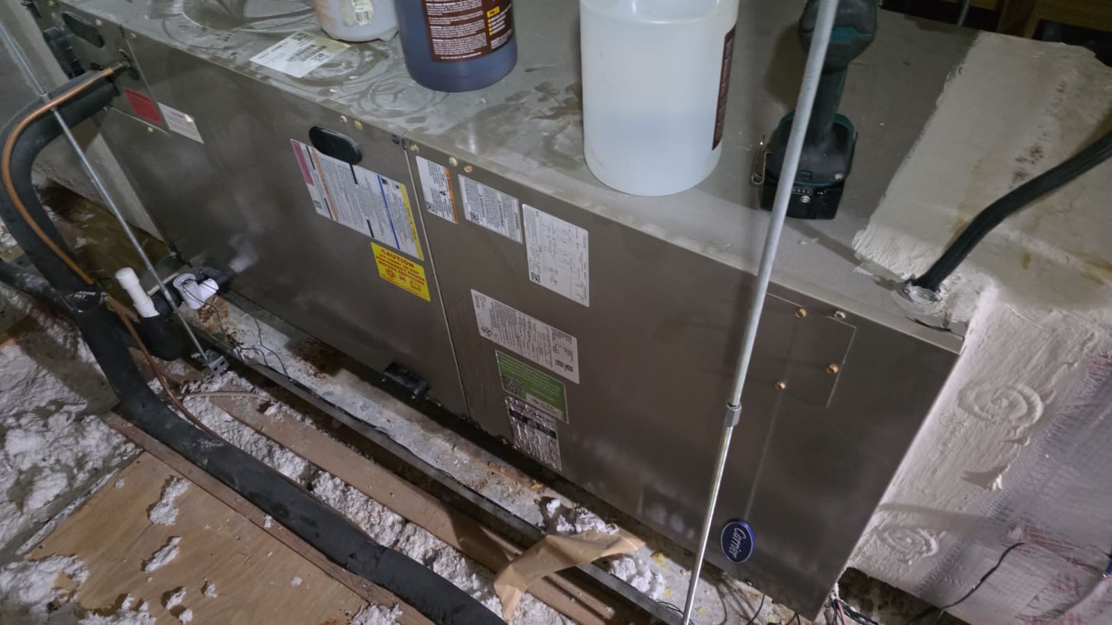 HVAC system setup in attic with components and labels during Premium Therapy Plan in Tarpon Springs, FL 34689.