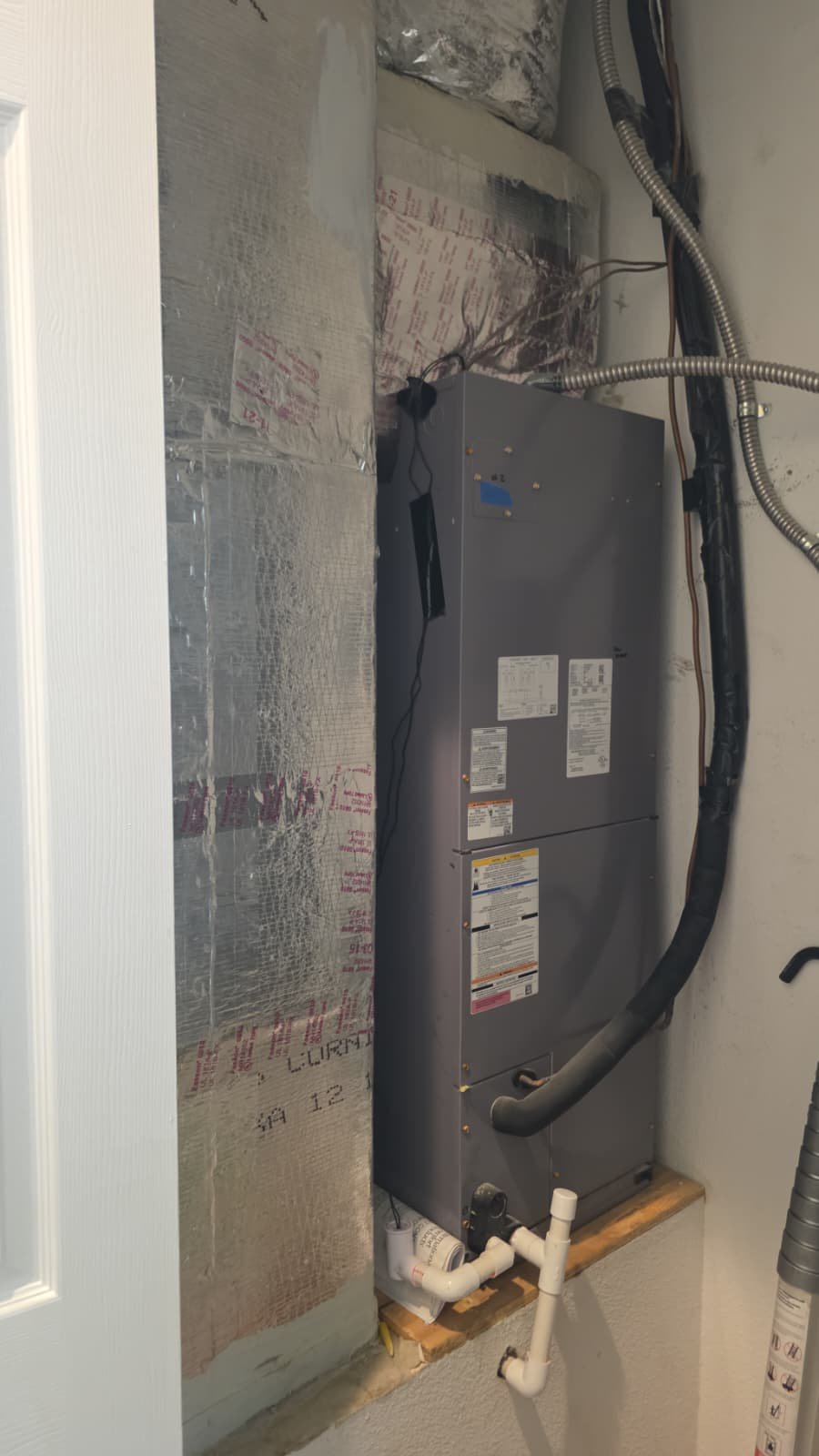 HVAC System in Utility Closet - Tarpon Springs, FL 34688 Installed HVAC system inside a utility closet in Tarpon Springs, FL 34688. Efficient home heating and cooling.