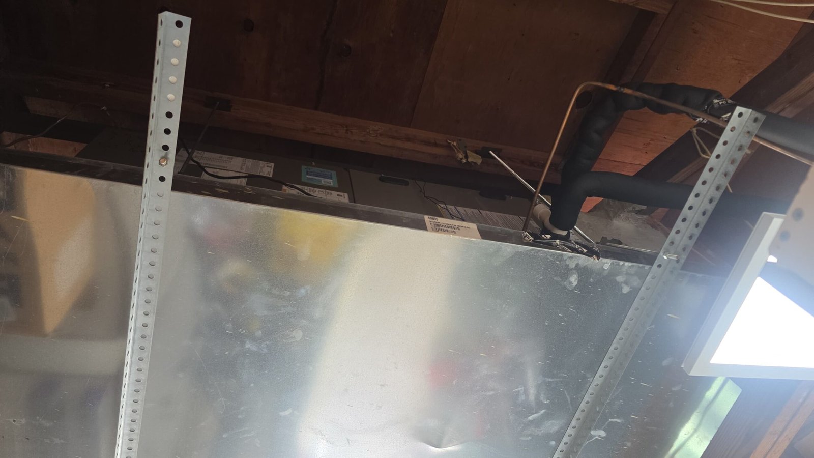 HVAC unit with ductwork in attic space in Largo, FL 33771.