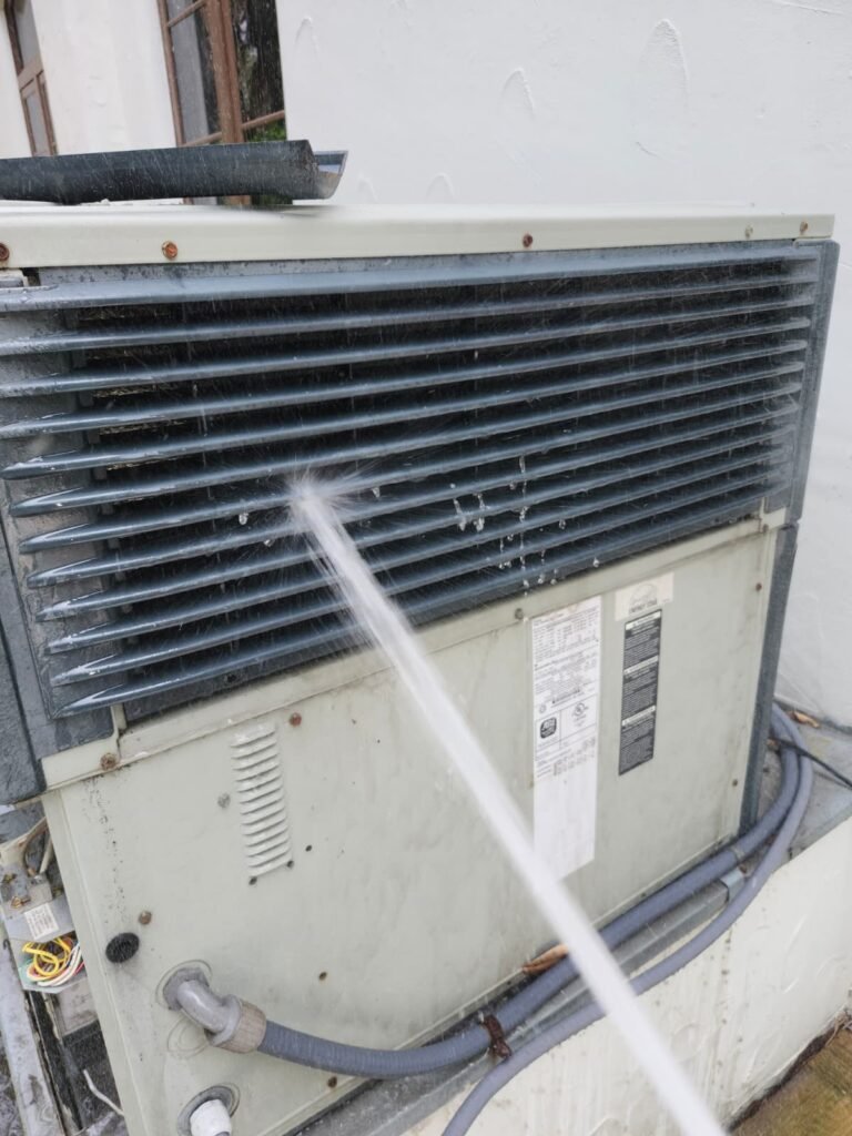 HVAC unit cleaning with water spray in Tampa, FL 33609