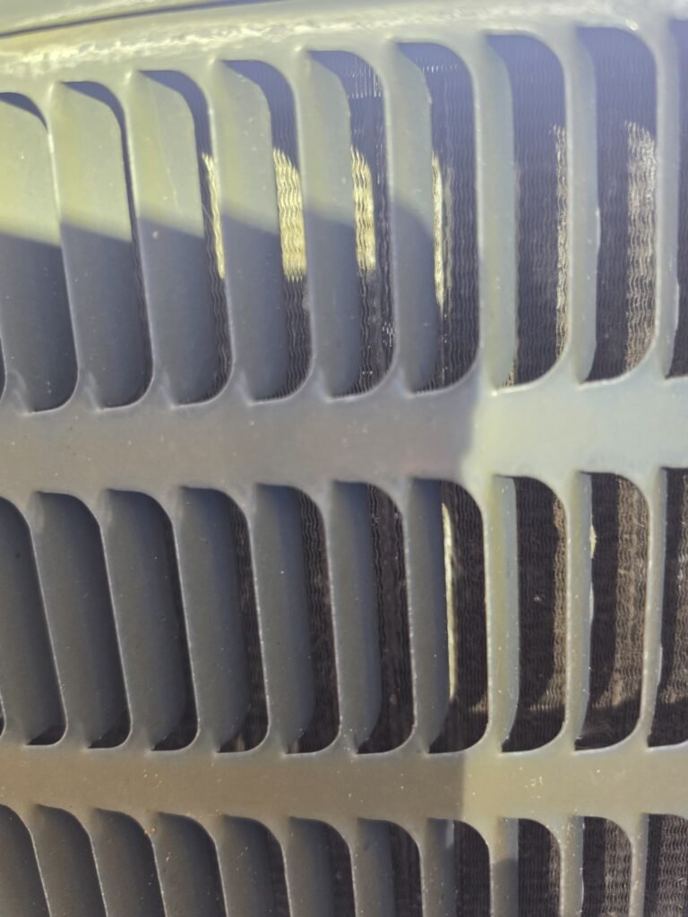 Close-up of HVAC unit exterior grille in Tampa, FL 33610