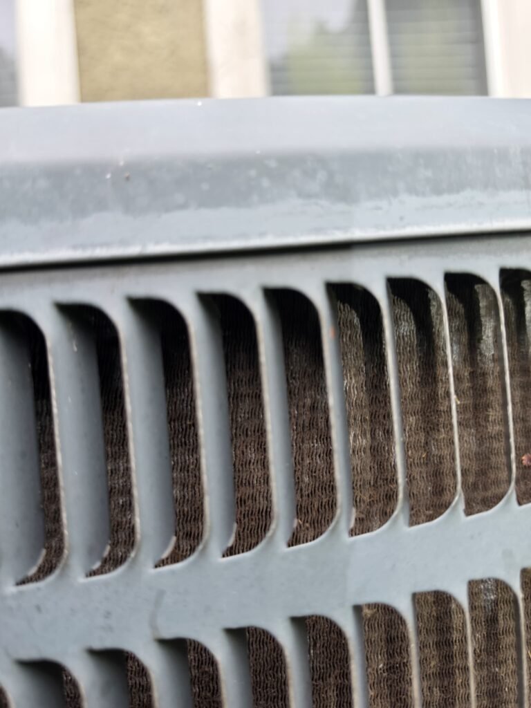 Close-up of HVAC unit exterior grille in Tampa, FL 33610