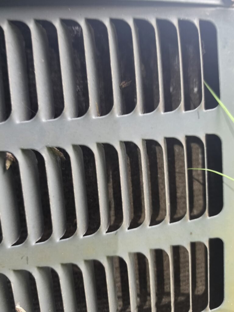 Close-up of HVAC unit exterior grille in Tampa, FL 33610