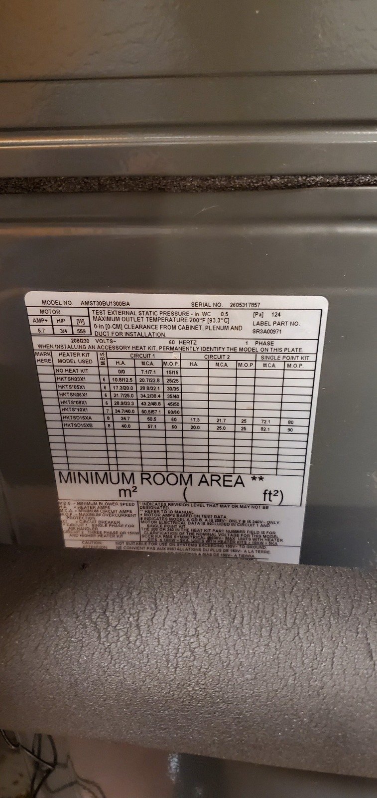Close-up of HVAC unit label with specs in Tampa, FL 33616.