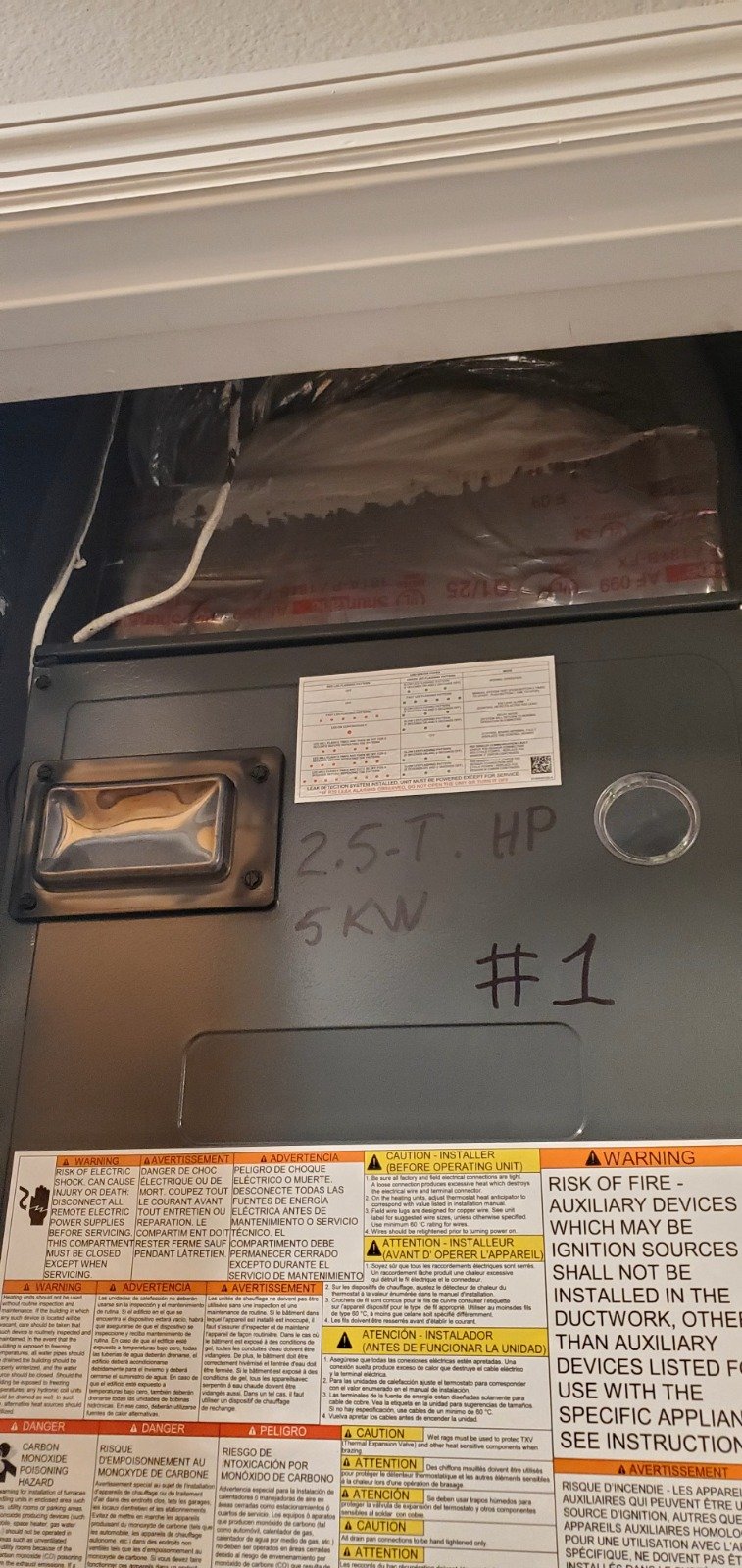 Top section of HVAC unit with notes in Tampa, FL 33616.