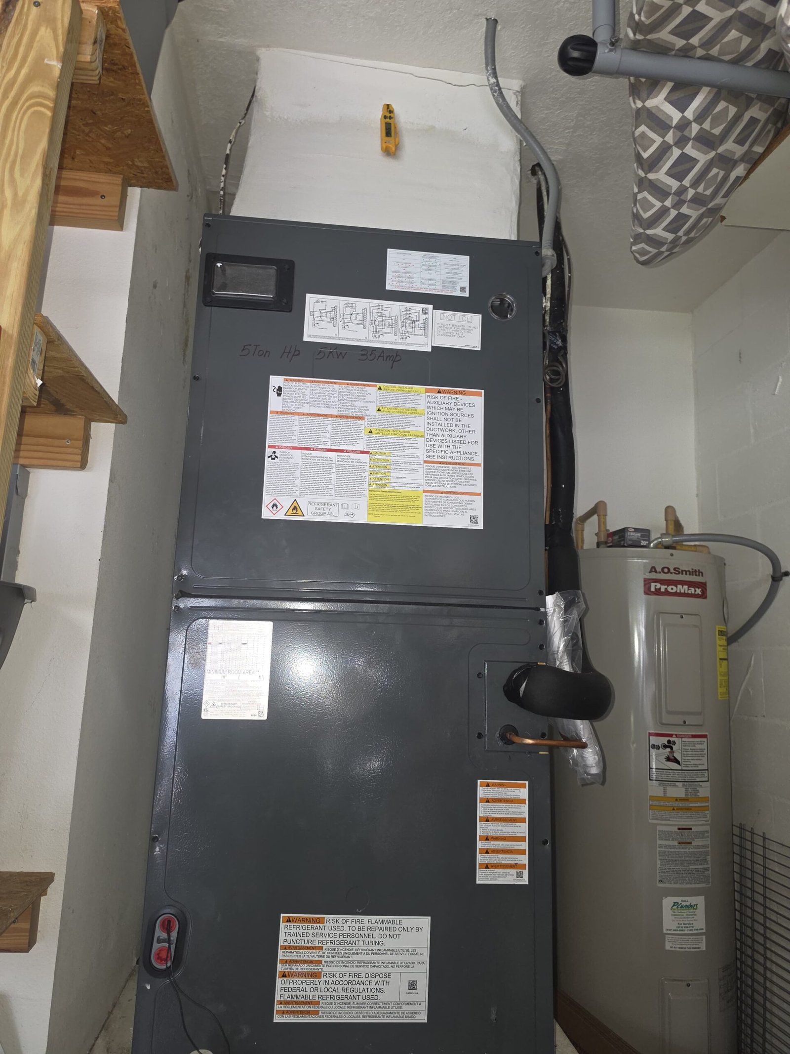 HVAC unit in utility room with labels, Land O Lakes, FL 34638.