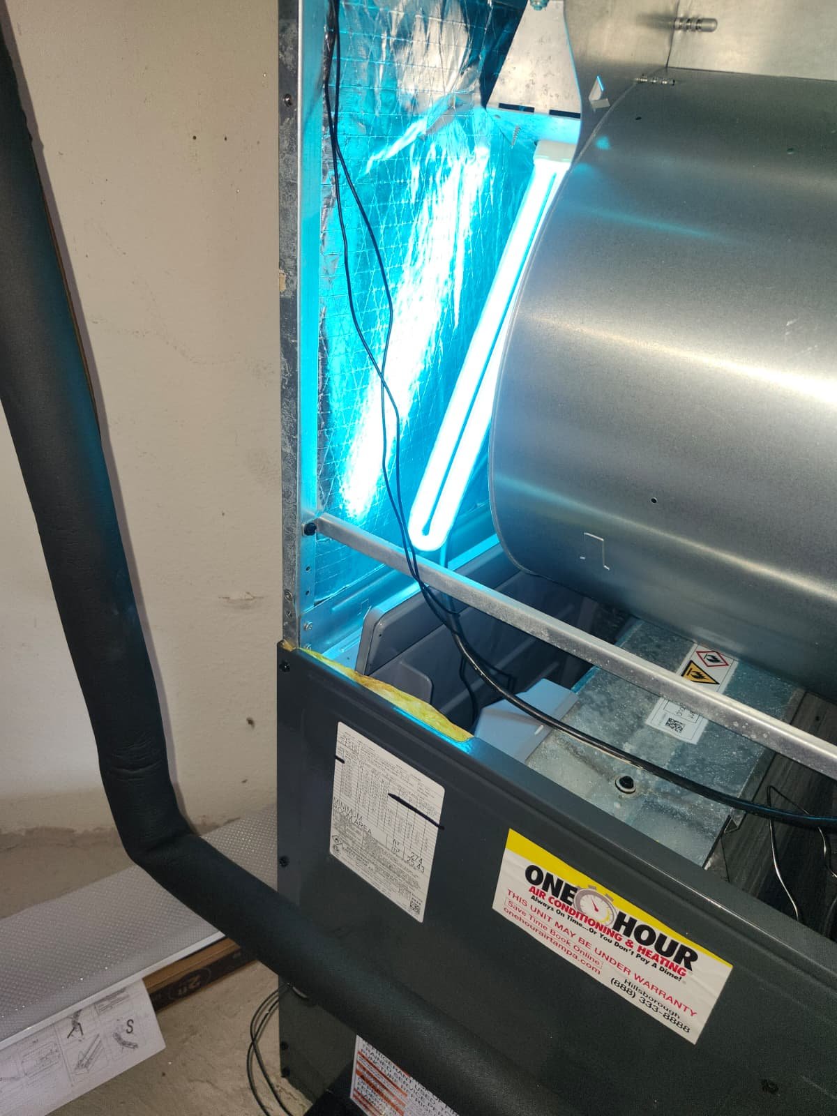 HVAC with UV Light - Brandon, FL 33511 HVAC unit with UV light glowing blue in Brandon, FL 33511. In-progress installation.