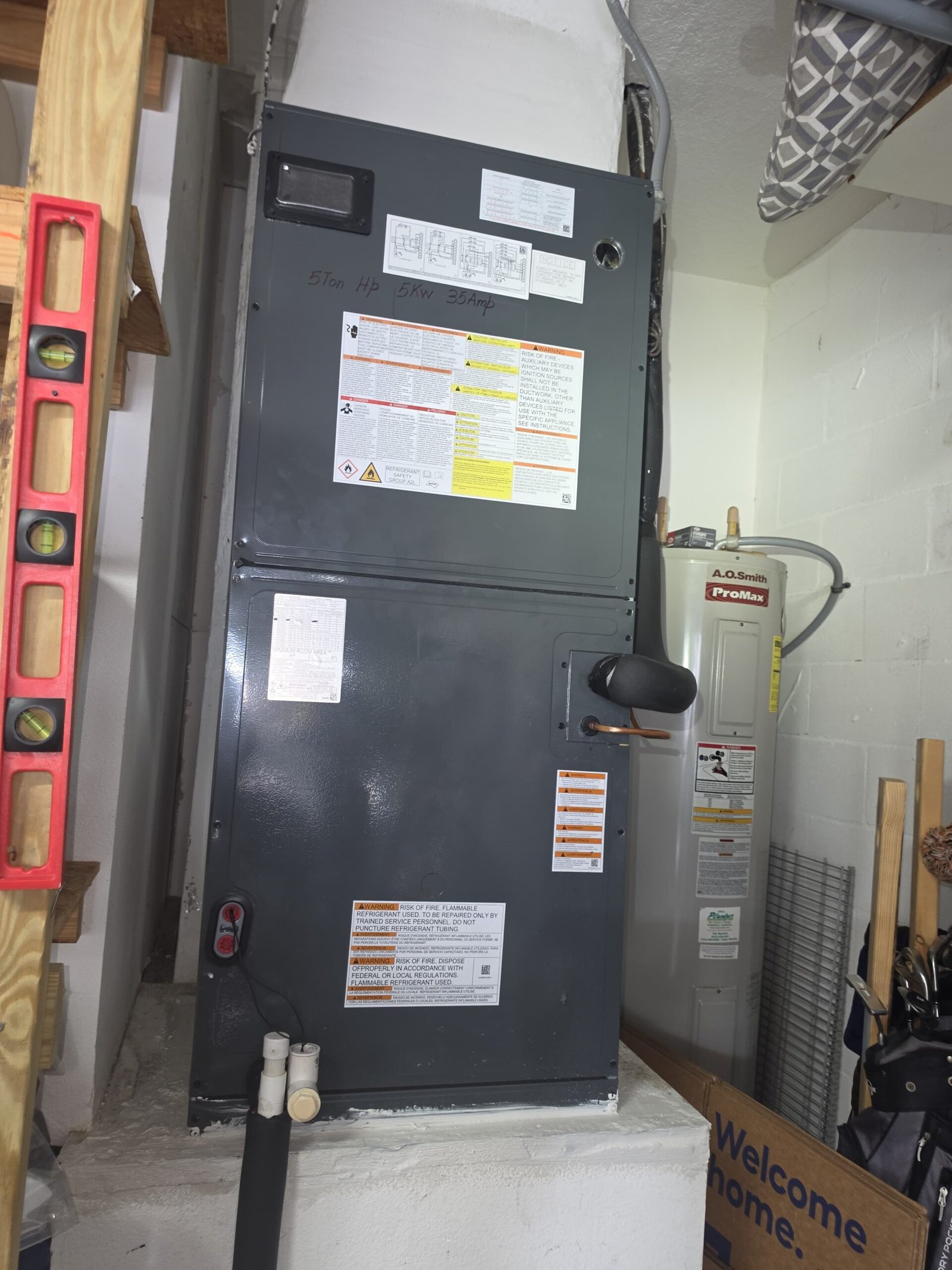 HVAC unit with water heater in utility room, Land O Lakes, FL 34638.