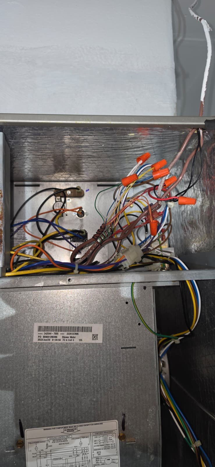 HVAC Wiring - Spring Hill, FL 34609 Open HVAC unit showing internal wiring in Spring Hill, FL 34609. In-progress installation work.