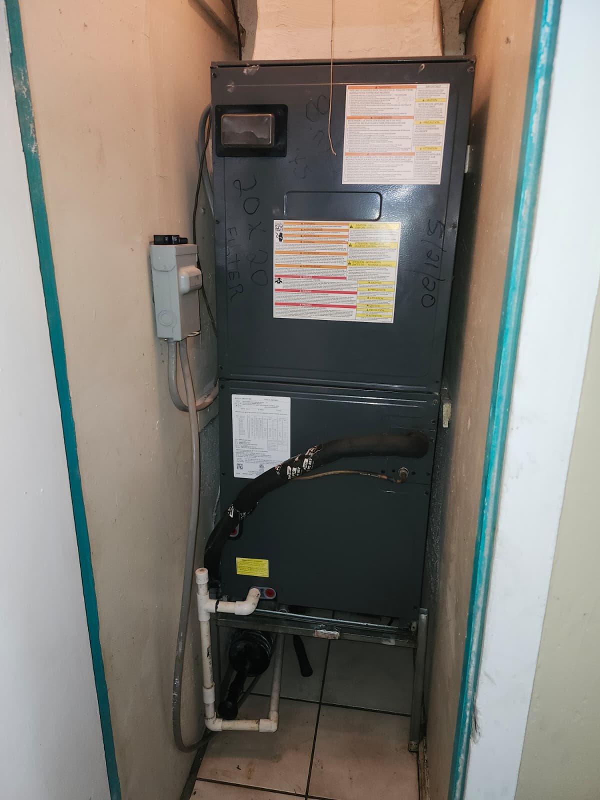 Indoor HVAC unit installed in narrow closet space in Tampa, FL 33607.