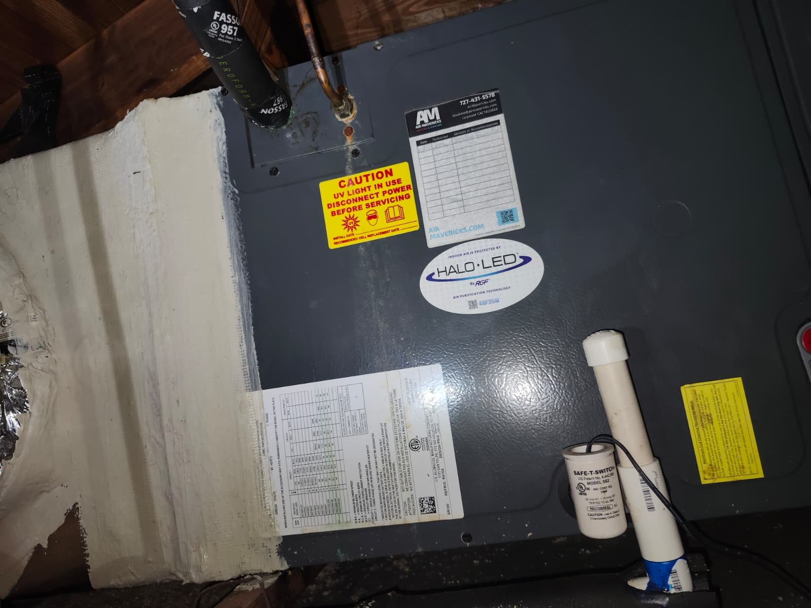Indoor HVAC unit with labels, St. Petersburg, FL 33703.