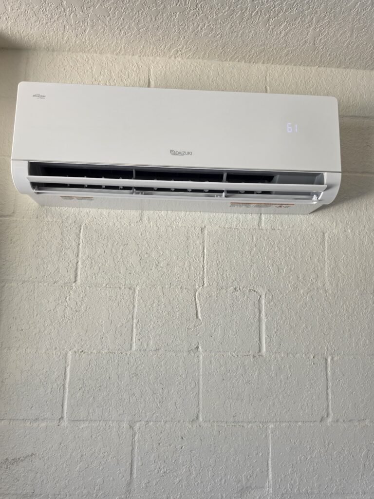 An indoor mini-split head on a block wall in Zephyrhills, FL 33541.