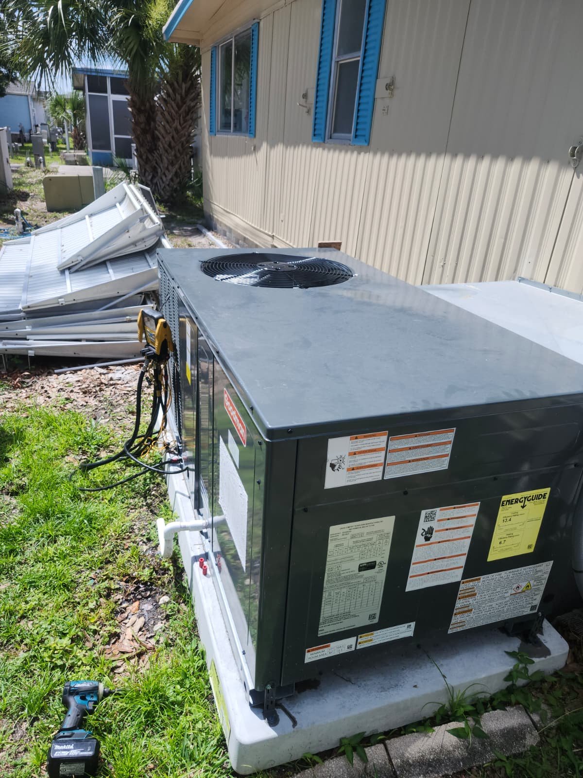 Installed Goodman AC unit with surrounding area in Odessa, FL 33556. Reliable air conditioning.