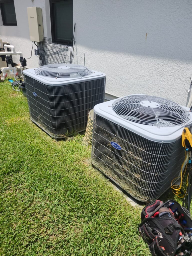 Multimeter Use Near HVAC Unit, Land O' Lakes, FL 34637 Technician with multimeter near HVAC unit in Land O' Lakes, FL 34637