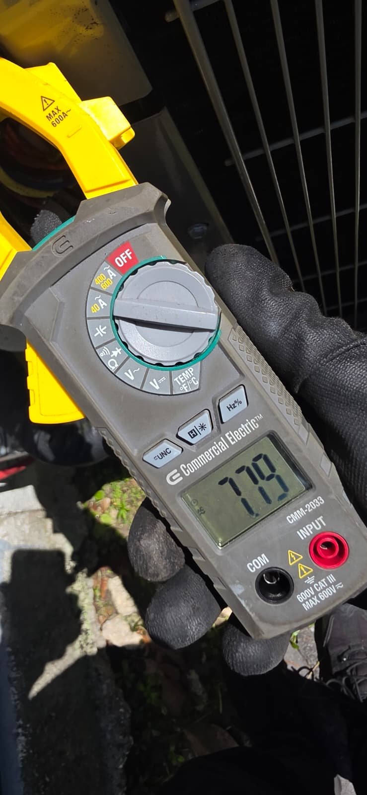 Multimeter showing voltage near HVAC equipment in Odessa, FL 33556. Accurate diagnostics.