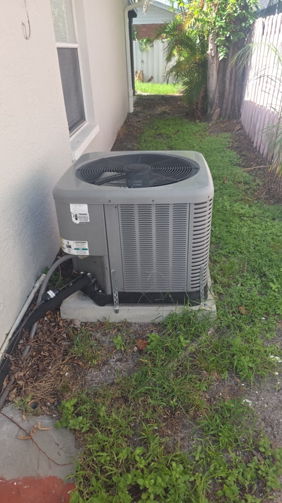 New AC Unit Installation - Tampa, FL 33607 New AC unit installed on concrete pad in Tampa, FL 33607.