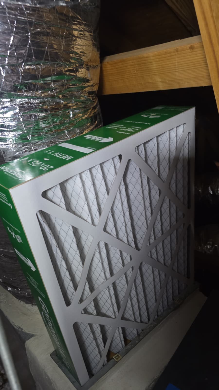 New air filter placed next to ductwork in attic during Premium Therapy Plan in Tarpon Springs, FL 34689.