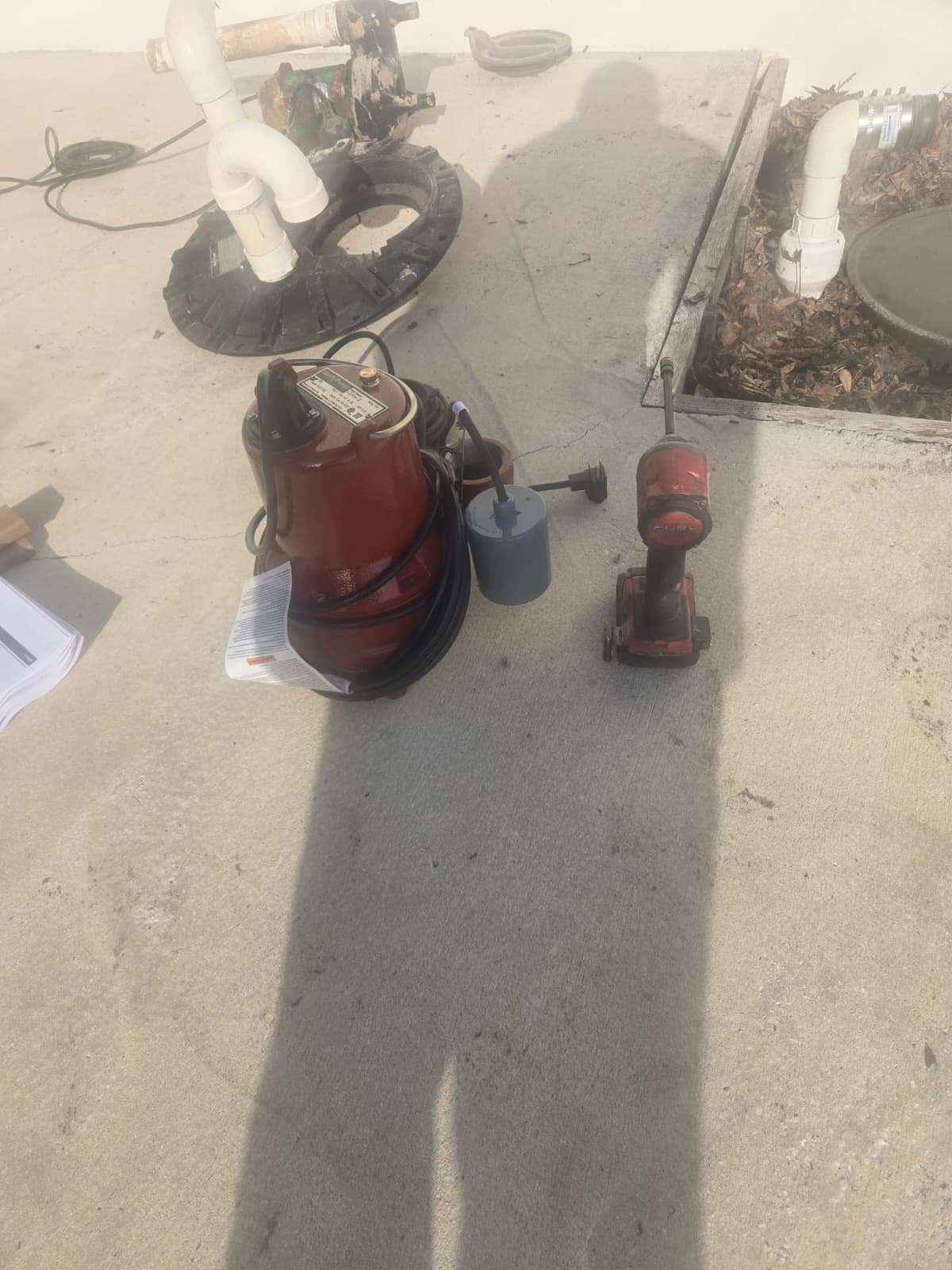 New Pump and Tools - Tampa, FL 33634 New submersible sewage pump and tools on the ground in Tampa, FL 33634.