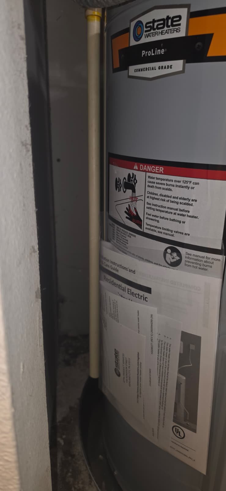 New Water Heater Side View in Tampa, FL 33615 Side view of new water heater with warning labels, Tampa, FL 33615.
