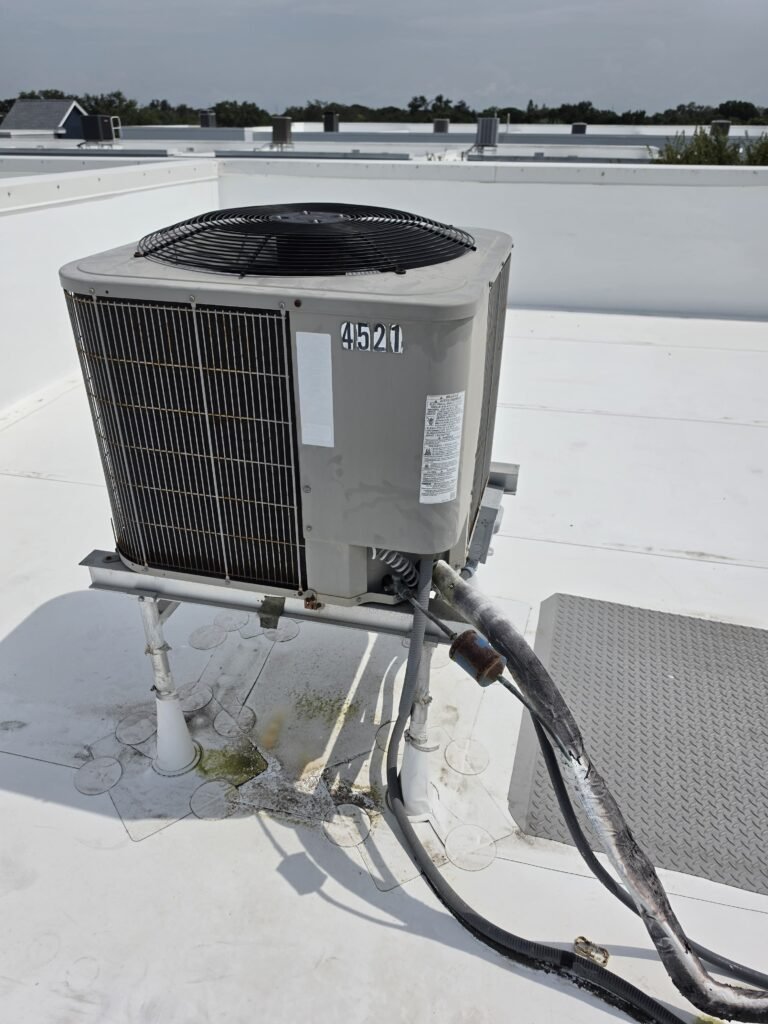 Old HVAC Unit Before Replacement in Tampa, FL 33611 Old HVAC unit on rooftop before replacement in Tampa, FL 33611