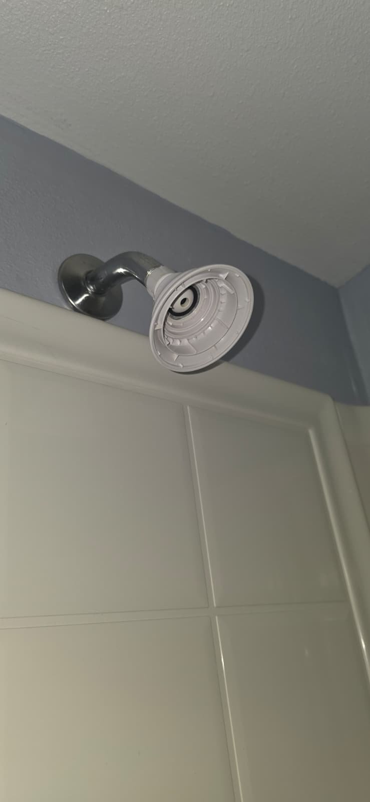 Old shower head with missing cover in Port Richey, FL 34668. Before plumbing upgrade.
