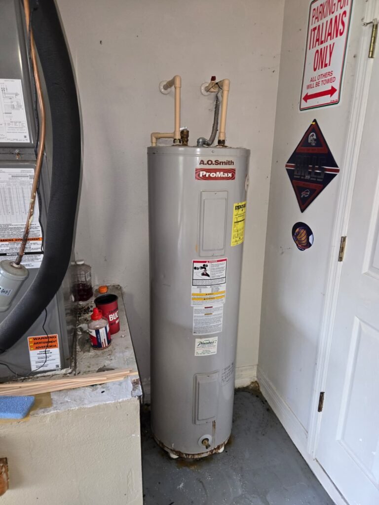 Old Water Heater in Garage Before Installation in Zephyrhills, FL 33541 Old water heater in garage before installation in Zephyrhills, FL 33541