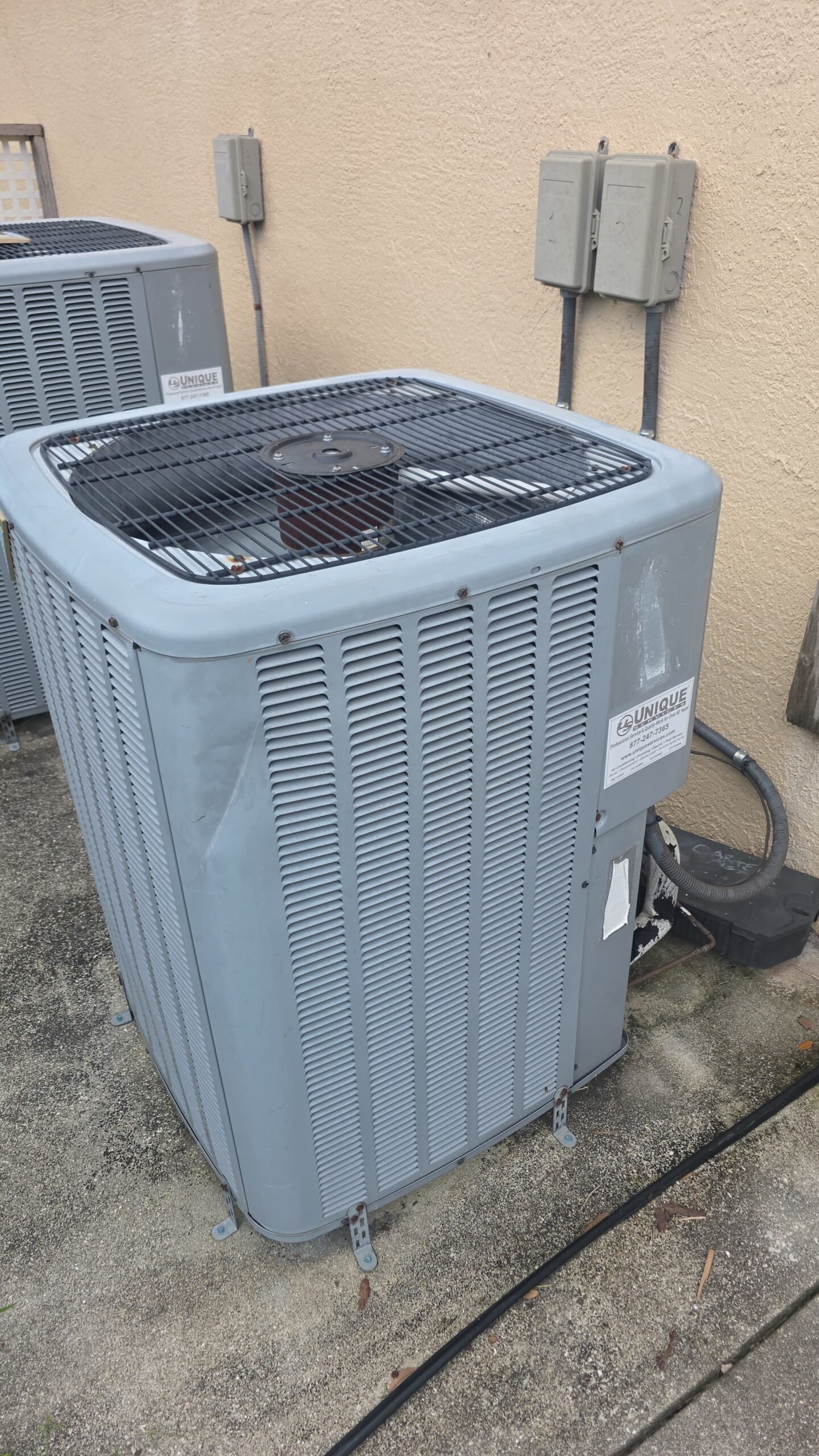 Elite Therapy Plan Visit #7: Outdoor AC unit on concrete slab, Bradenton, FL 34202.