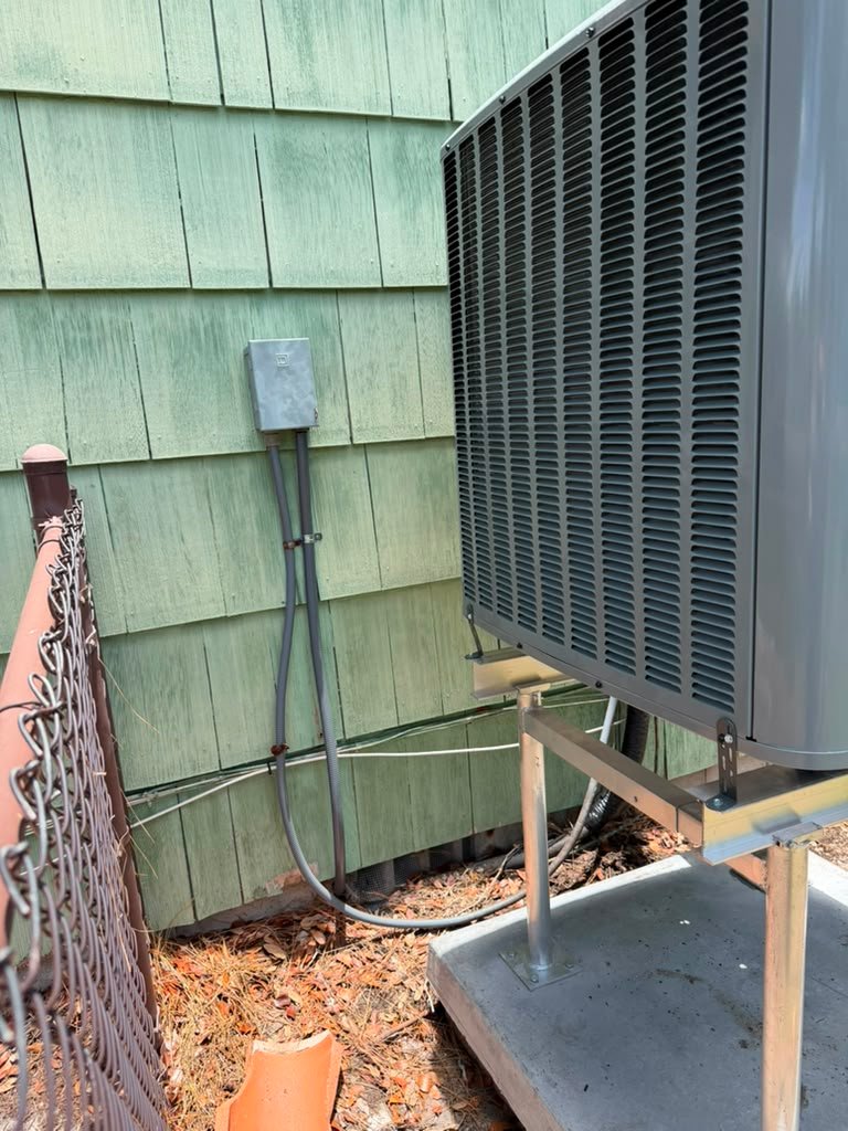 Outdoor AC Unit in Gulfport, FL 33707 Outdoor air conditioning unit installed beside a house in Gulfport, FL 33707.