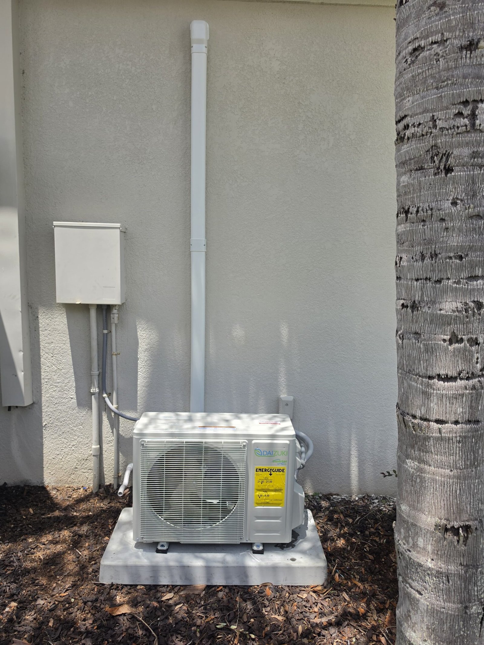 Outdoor Daizuki mini split AC unit on concrete pad in Lutz, FL 33558.