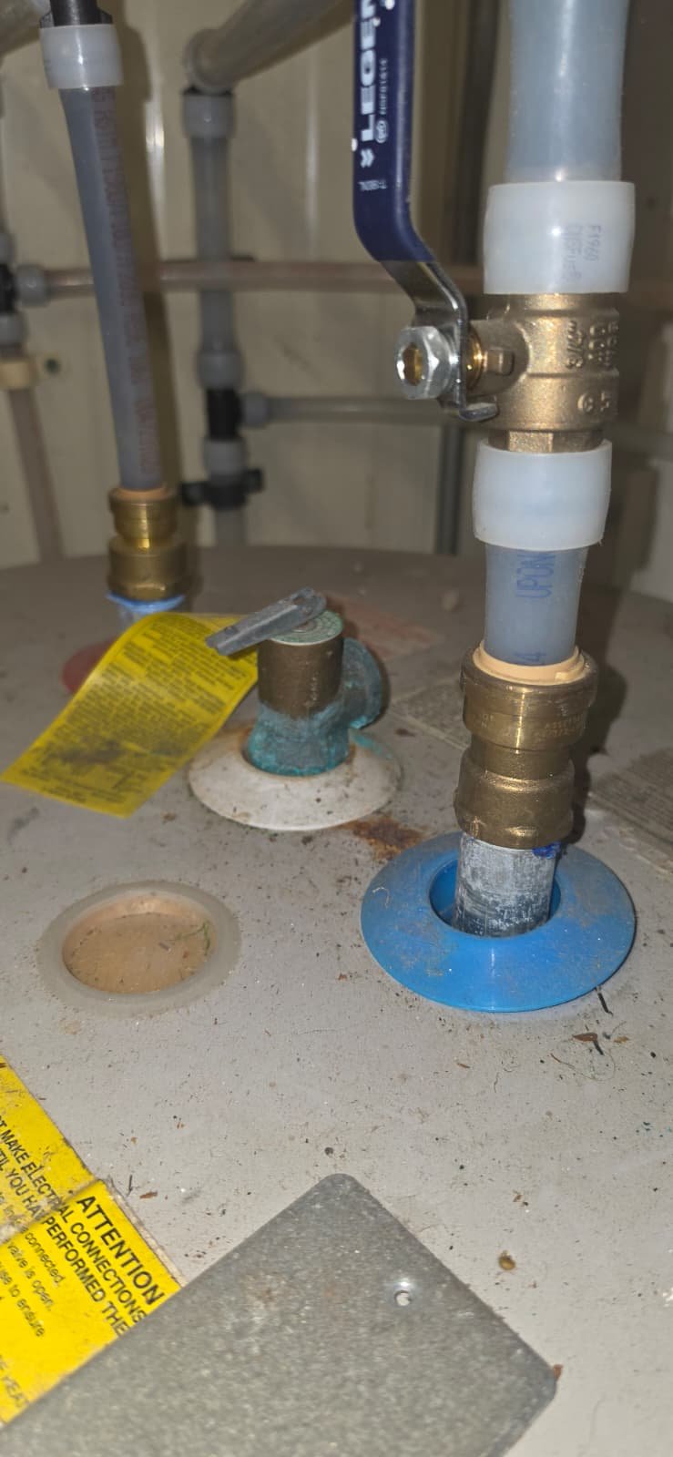 Close-up of plumbing connections on water heater in Port Richey, FL 34668. Professional installation.