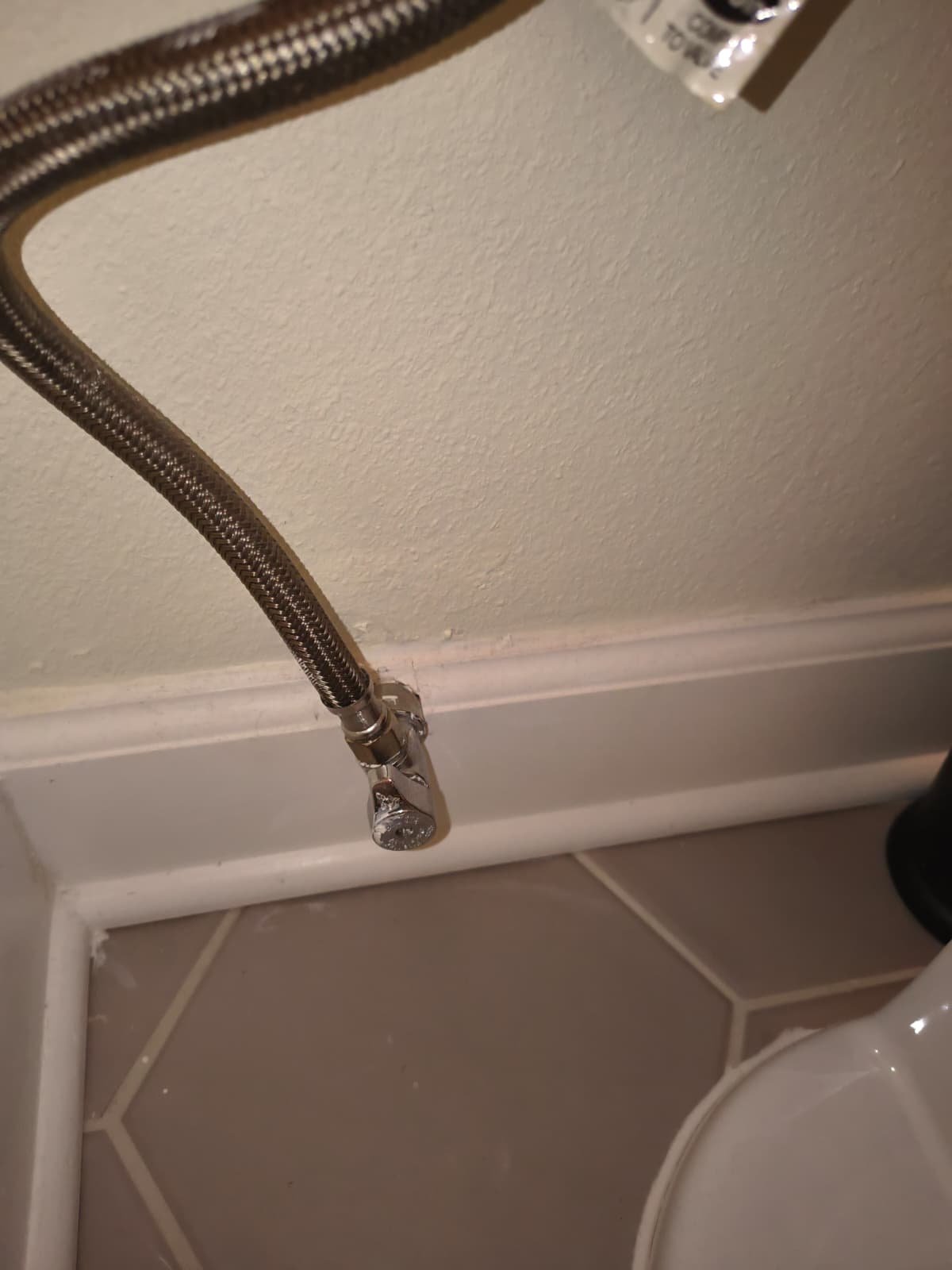 Plumbing hose and valve near floor, Tampa, FL 33609