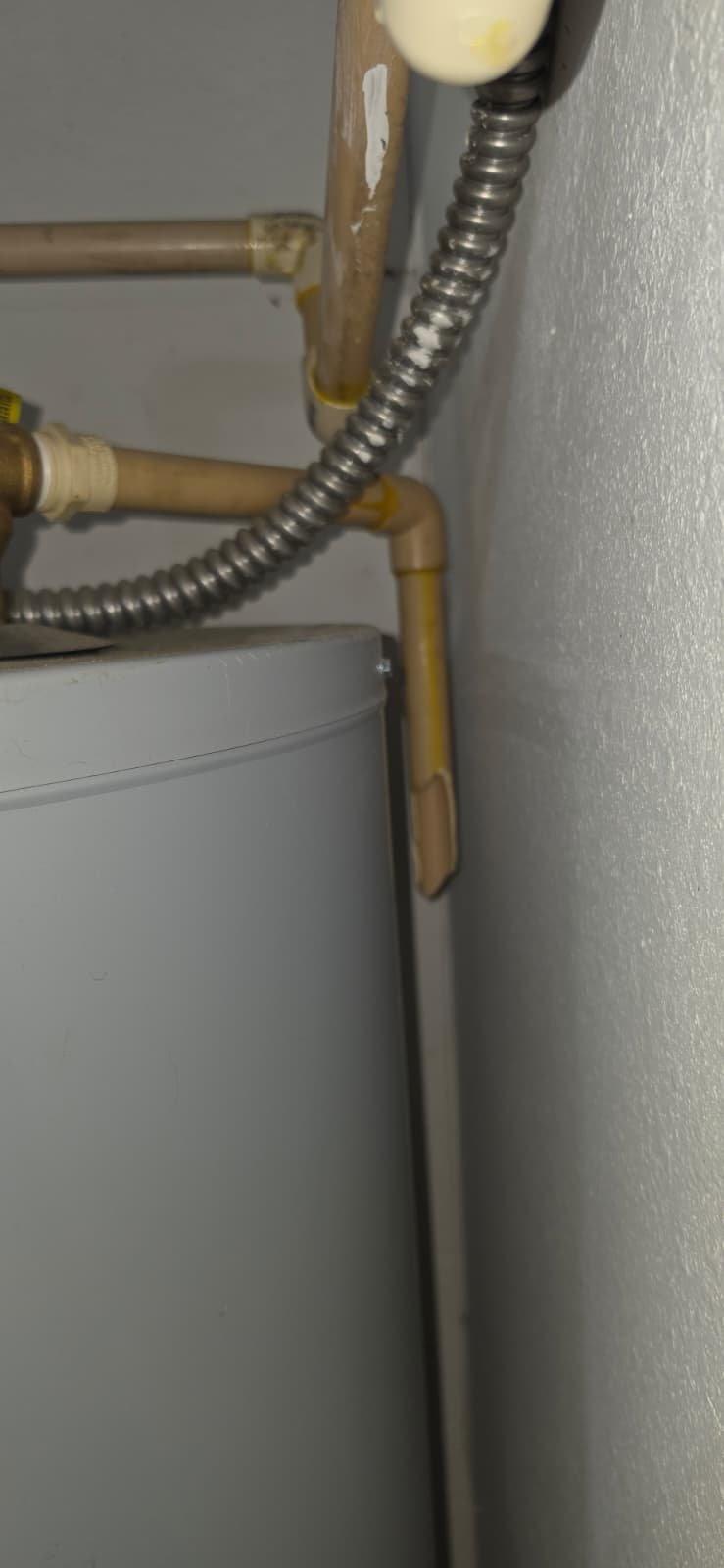 Plumbing Pipes Detail - Tampa, FL 33626 Close-up of plumbing pipes on water heater, Tampa, FL 33626.