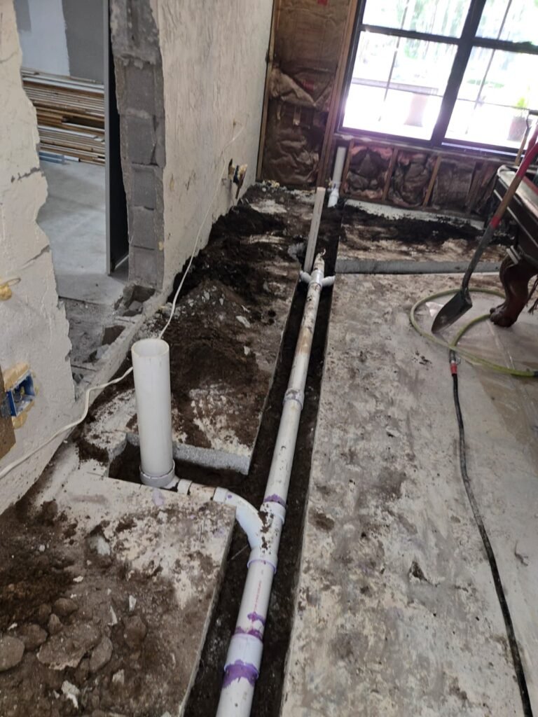 New plumbing pipes laid in a trench during a renovation in Tampa, FL 33624