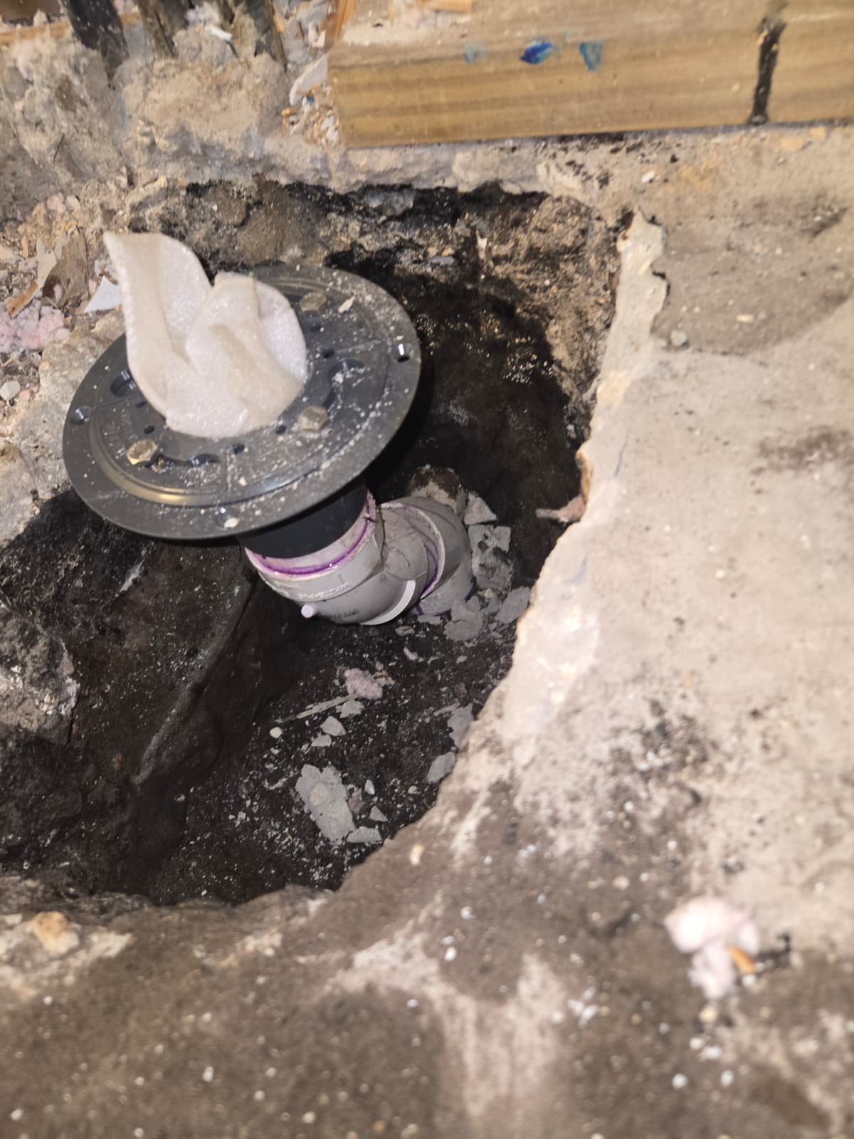 Exposed pipe in floor during plumbing work in Tampa, FL 33624.