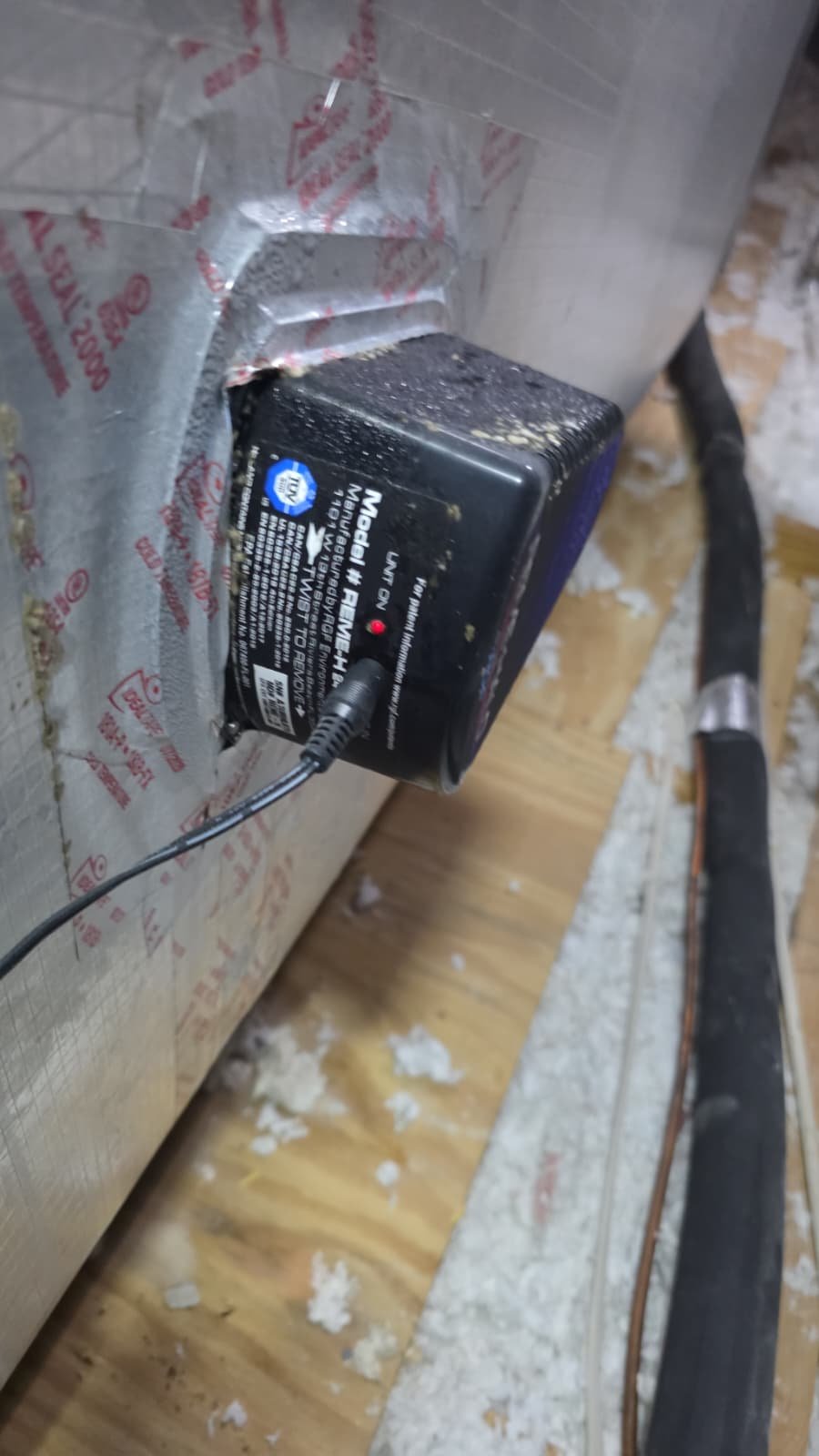 Close-up of power adapter connected to HVAC ductwork during Premium Therapy Plan in Tarpon Springs, FL 34689.