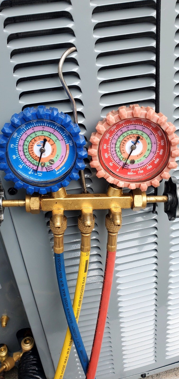 Close-up of pressure gauges on HVAC unit in Tampa, FL 33616.