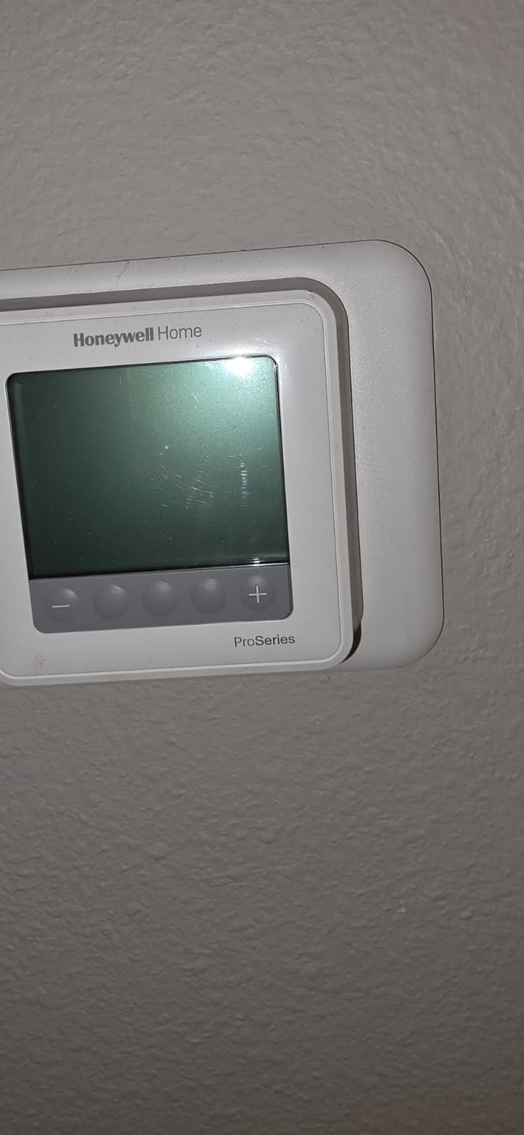 ProSeries Thermostat Installed - Spring Hill, FL 34609 Honeywell Home ProSeries thermostat installed on wall in Spring Hill, FL 34609. Efficient temperature control.
