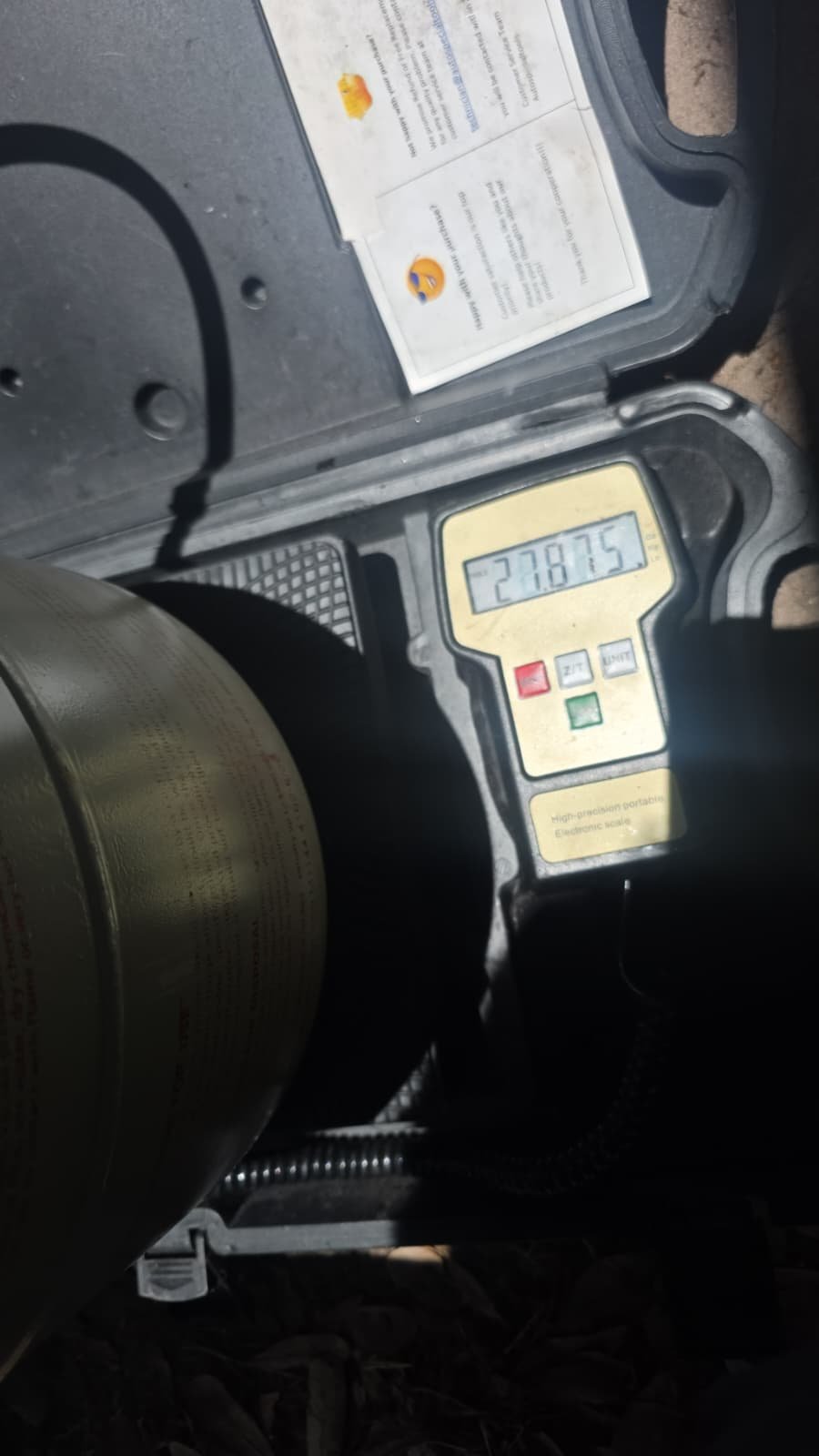 Digital scale showing weight during refrigerant charging in Riverview, FL 33579. In-progress service.